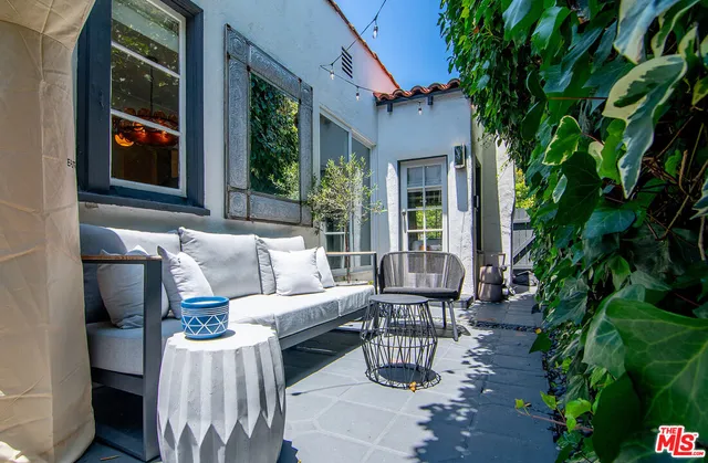 a spacious bedroom with a bed and a table in it