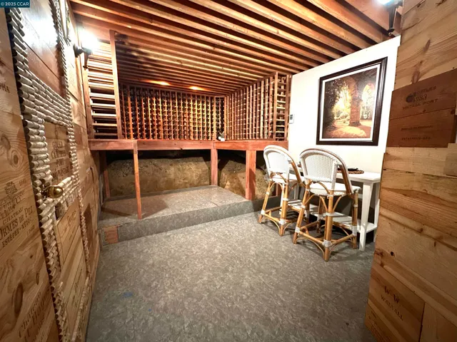 a view of a chairs with table in the backyard