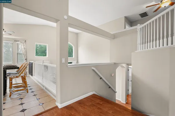 a view of front door and hallway with wooden floor