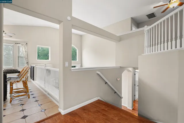 a view of front door and hallway with wooden floor