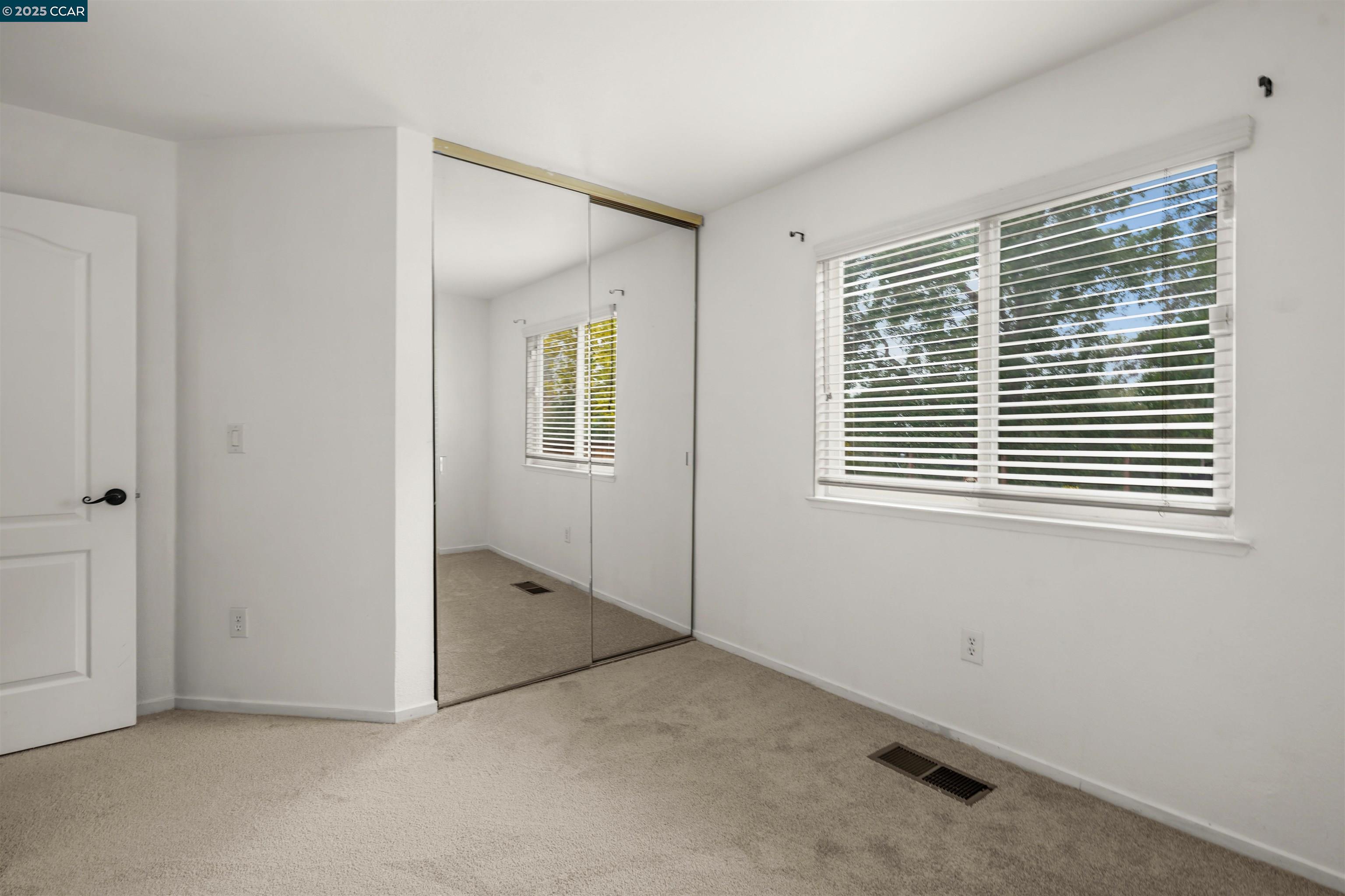 2063 Bluerock Court Concord, CA 94521 - Photo 20 of 38 a view of an empty room with a window