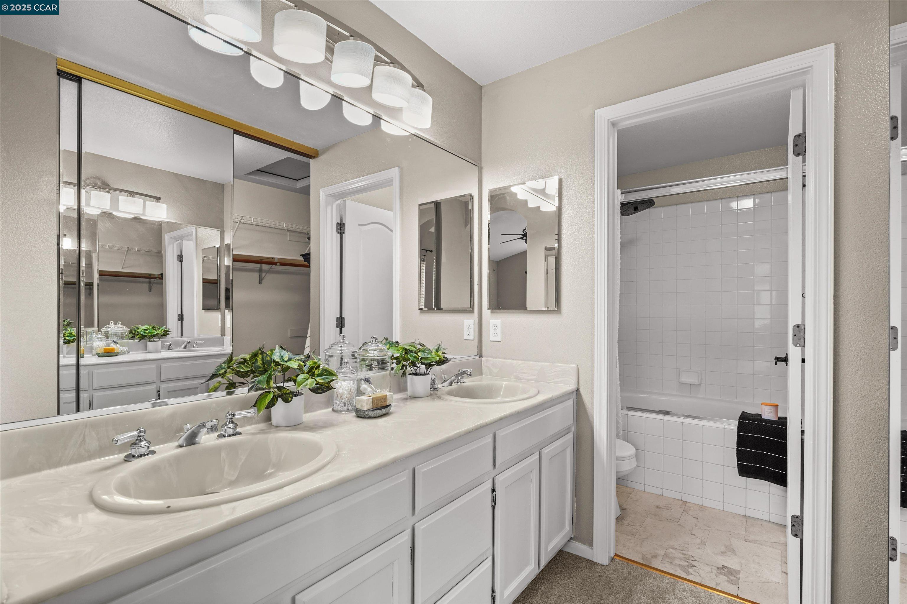 2063 Bluerock Court Concord, CA 94521 - Photo 31 of 38 a bathroom with a sink and a mirror