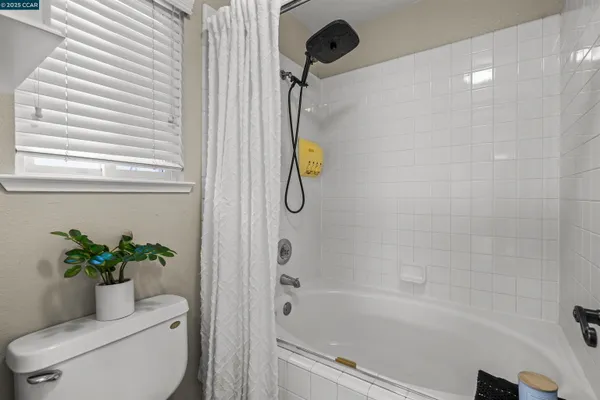 a bath room with a toilet