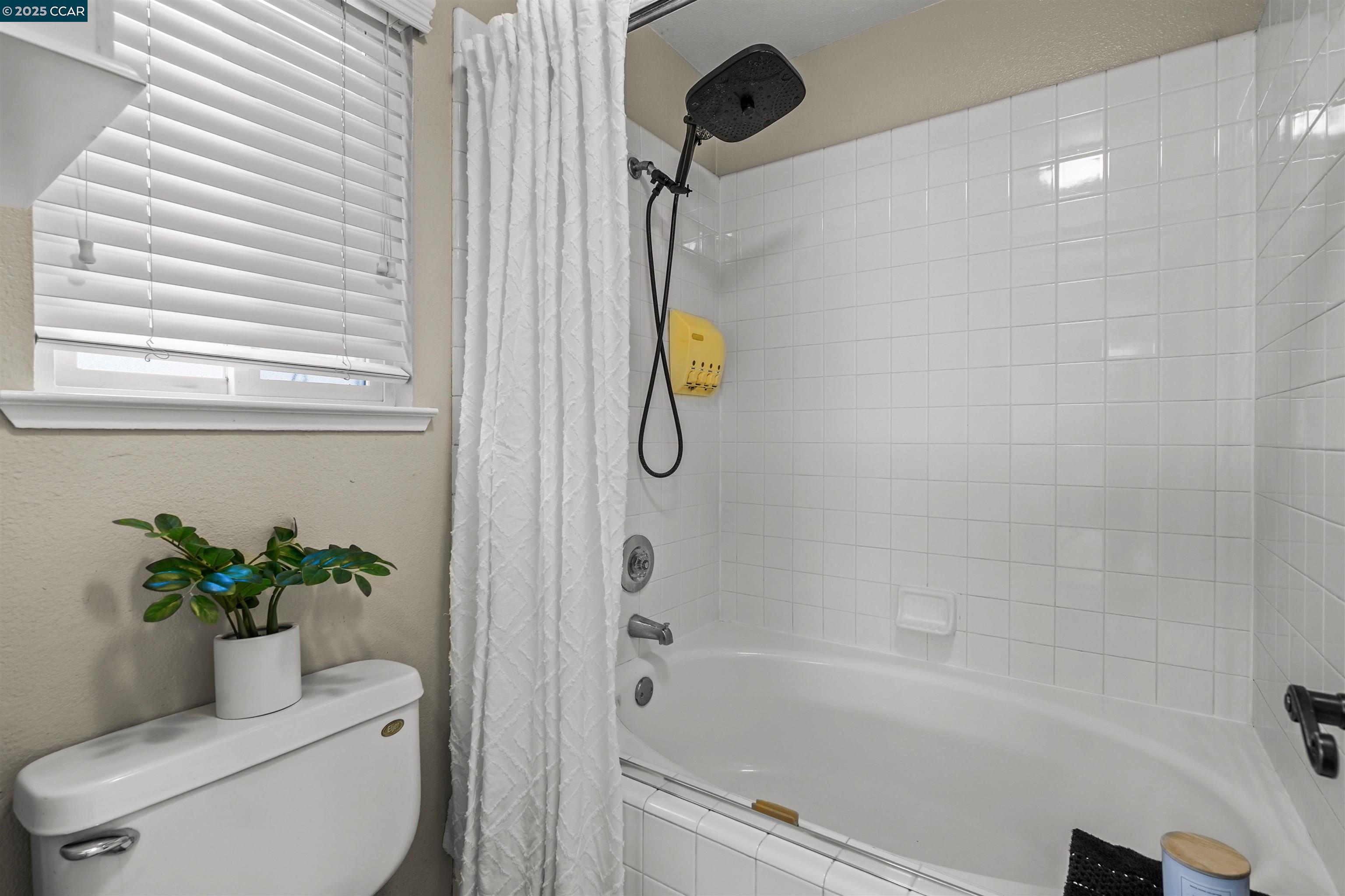 2063 Bluerock Court Concord, CA 94521 - Photo 32 of 38 a bath room with a toilet