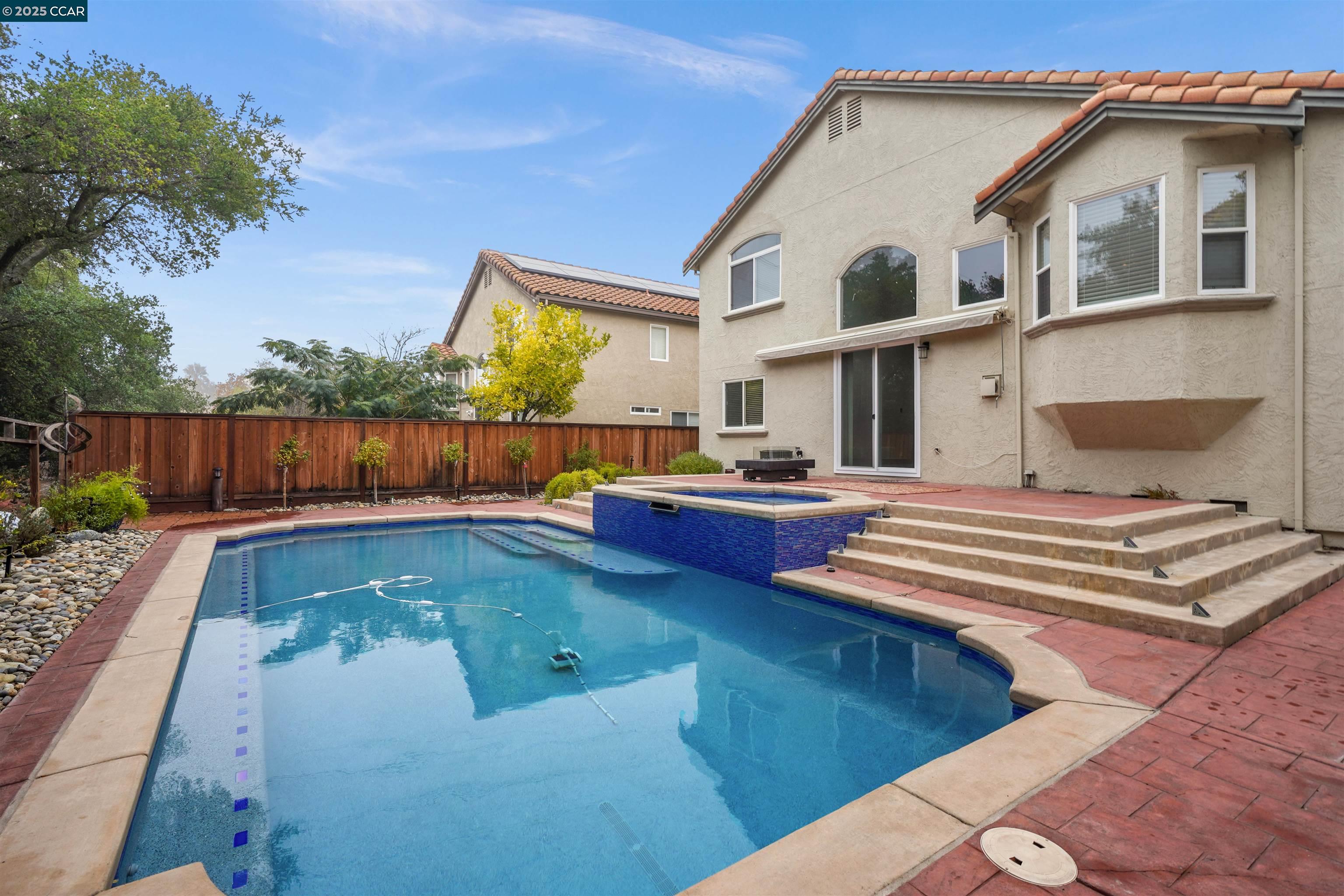 2063 Bluerock Court Concord, CA 94521 - Photo 37 of 38 a view of a patio with couches table and chairs with wooden fence