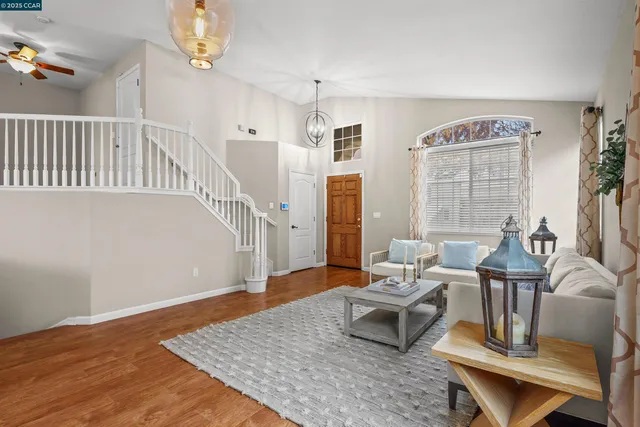 a living room with furniture and a table