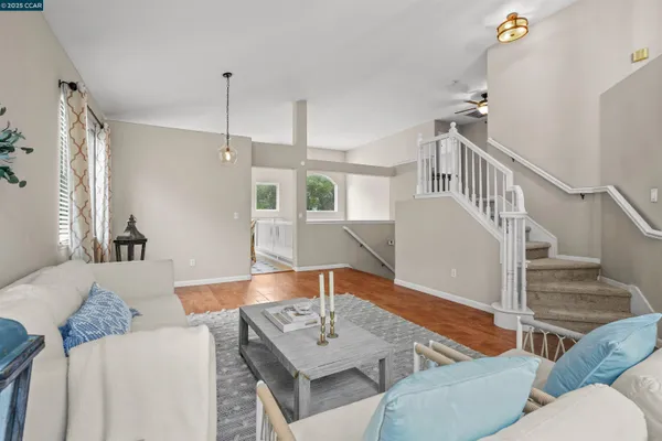 a living room with furniture and a table