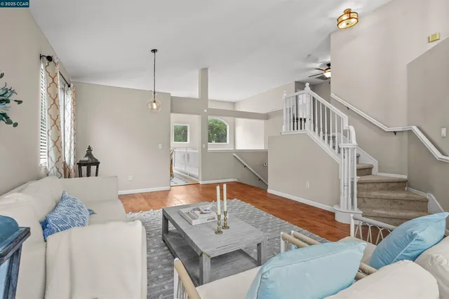 a living room with furniture and a table