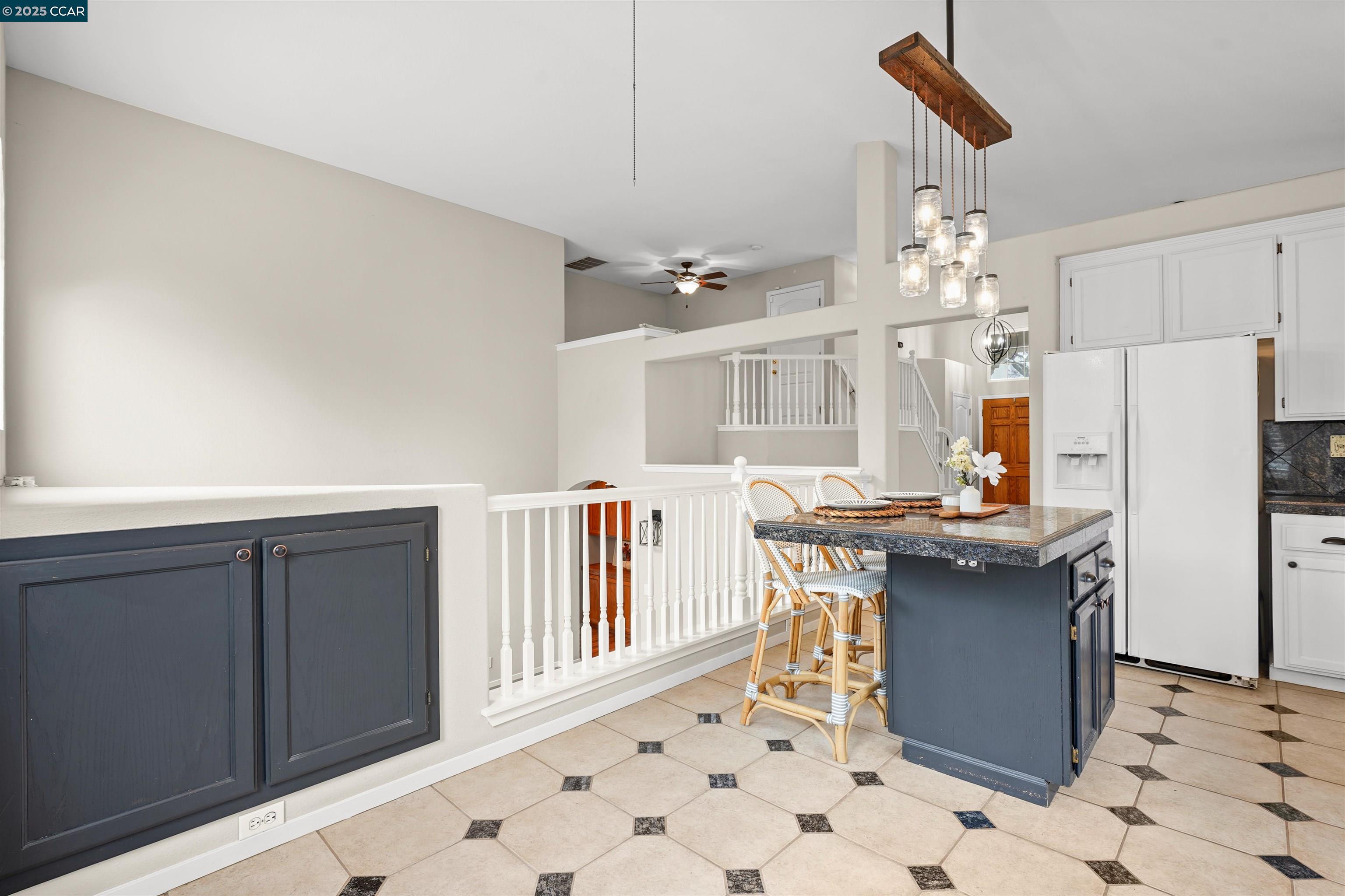 2063 Bluerock Court Concord, CA 94521 - Photo 10 of 38 a kitchen with stainless steel appliances a table and chairs in it