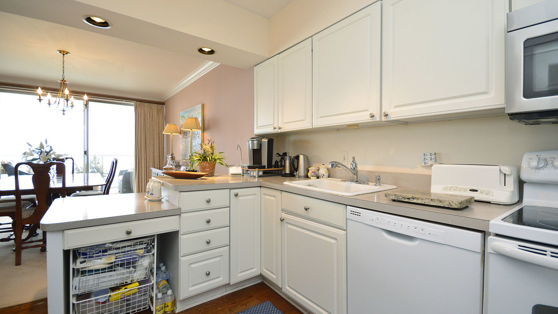 1616 Sheridan Road, Unit 7A Wilmette, IL 60091 - Photo 12 of 22 a kitchen with cabinets appliances a sink and a counter top space