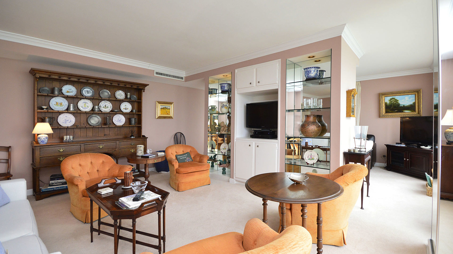 1616 Sheridan Road, Unit 7A Wilmette, IL 60091 - Photo 7 of 22 a living room with furniture a flat screen tv and a fireplace