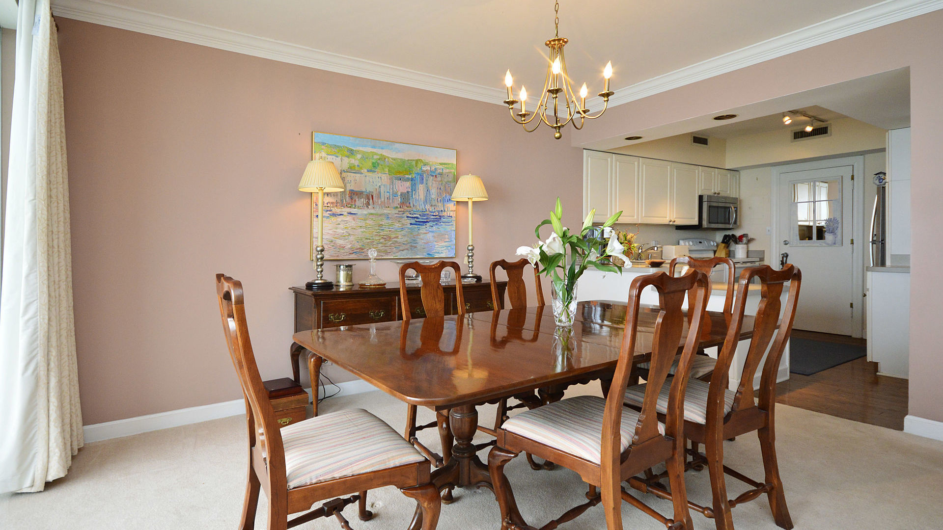 1616 Sheridan Road, Unit 7A Wilmette, IL 60091 - Photo 9 of 22 a view of a dining room with furniture and chandelier