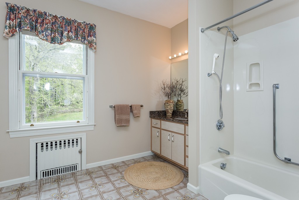 58 S Road Hampden, MA 01036 - Photo 23 of 28 a bathroom with a tub shower and window