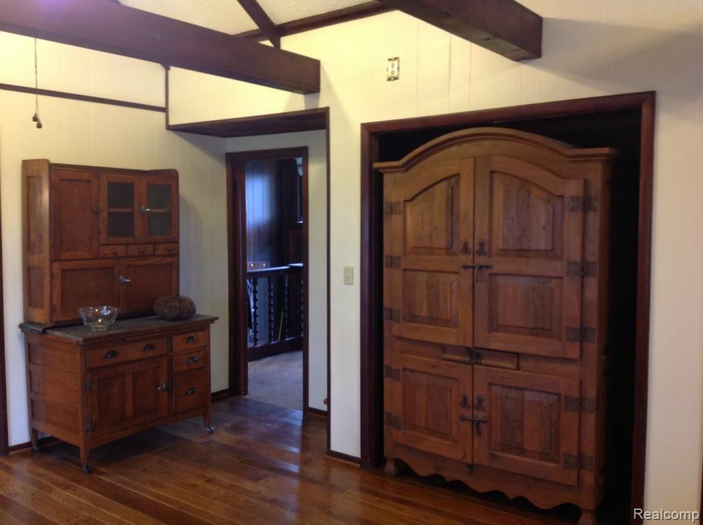 6147 Willis Road North Branch, MI 48461 - Photo 5 of 41 Living Room with Gorgeous Wood Floors and Beams