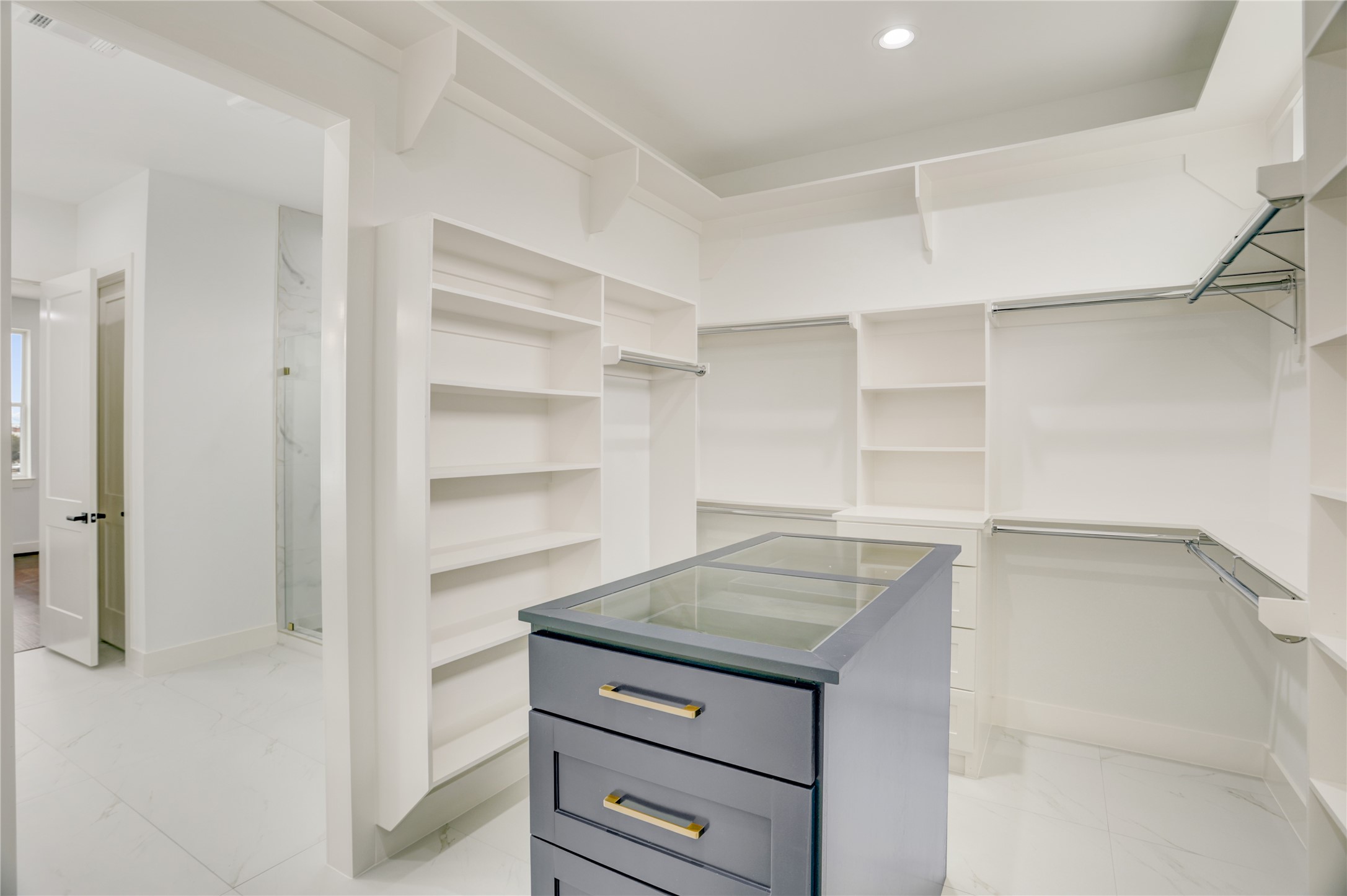 6814 Hartland Street Houston, TX 77055 - Photo 42 of 50 Primary closet ( there is also a smaller one as well.