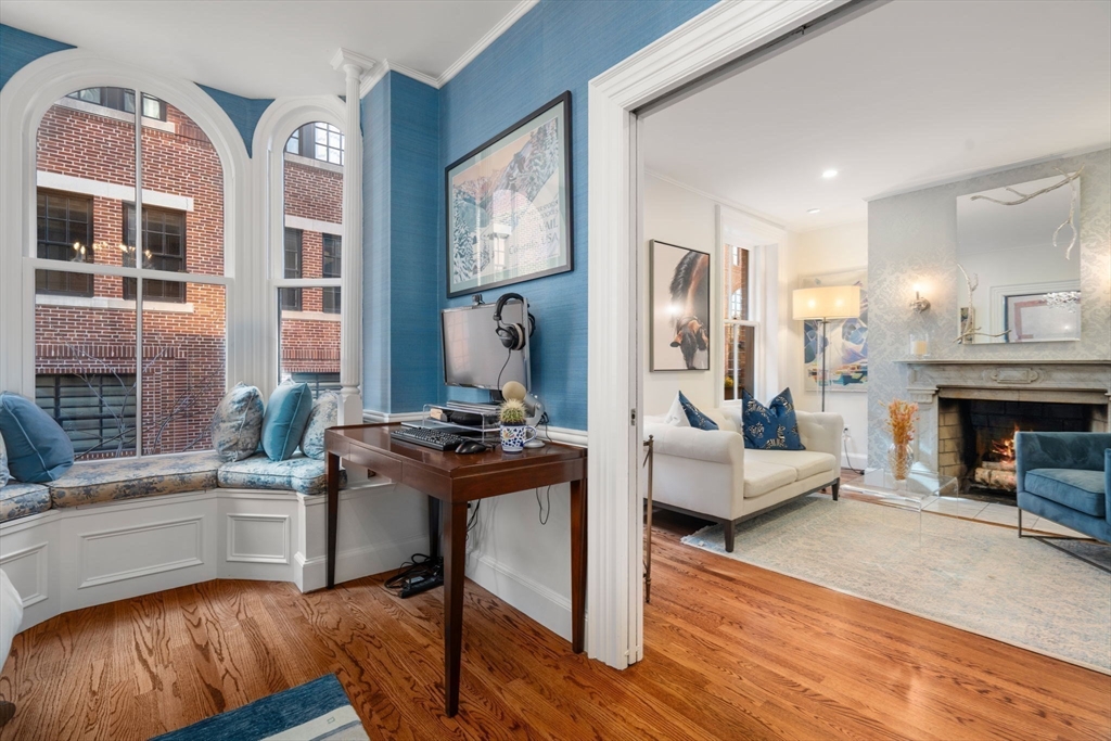 58 Temple Street, Unit 3 Boston, MA 02114 - Photo 5 of 17 a living room with furniture and a fireplace