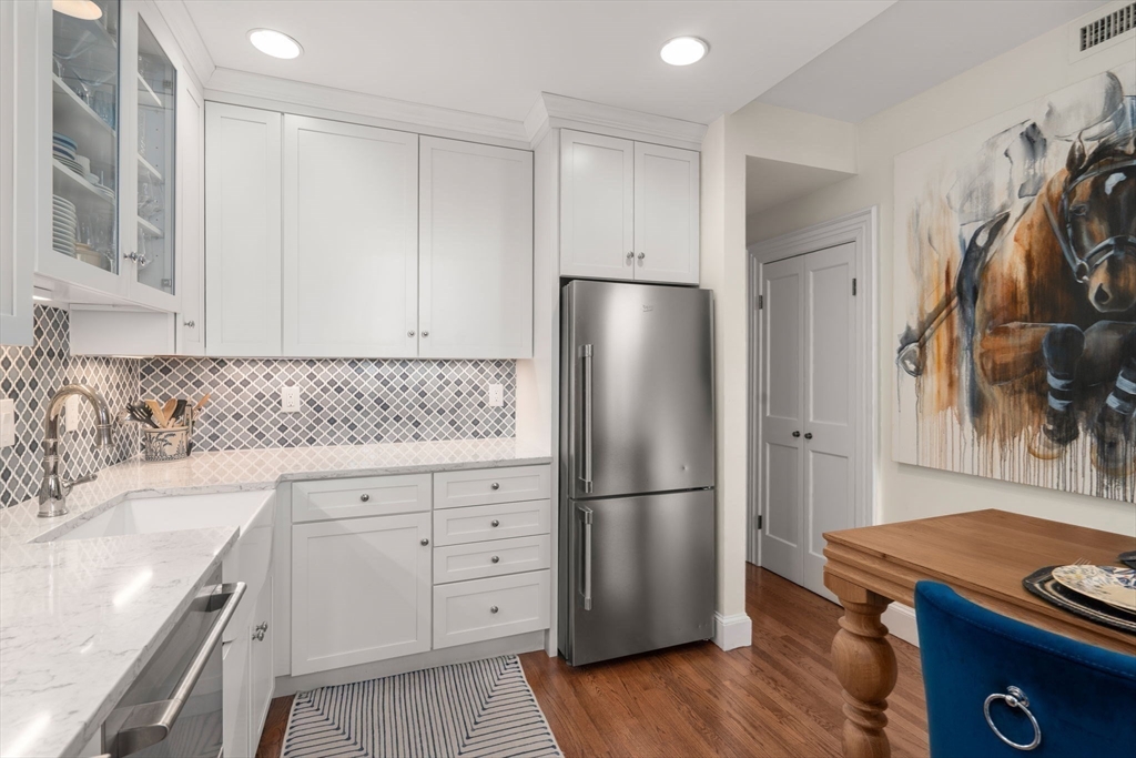 58 Temple Street, Unit 3 Boston, MA 02114 - Photo 6 of 17 a kitchen with a refrigerator and a stove top oven