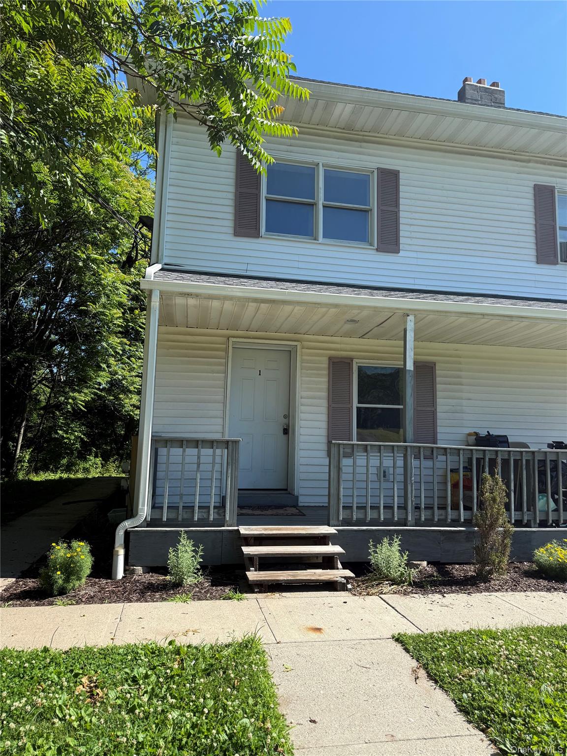 570 Mt Hope Road, Unit 1 Middletown, NY 10940 - Photo 2 of 41 Two-story residence featuring white vinyl siding and a covered front porch