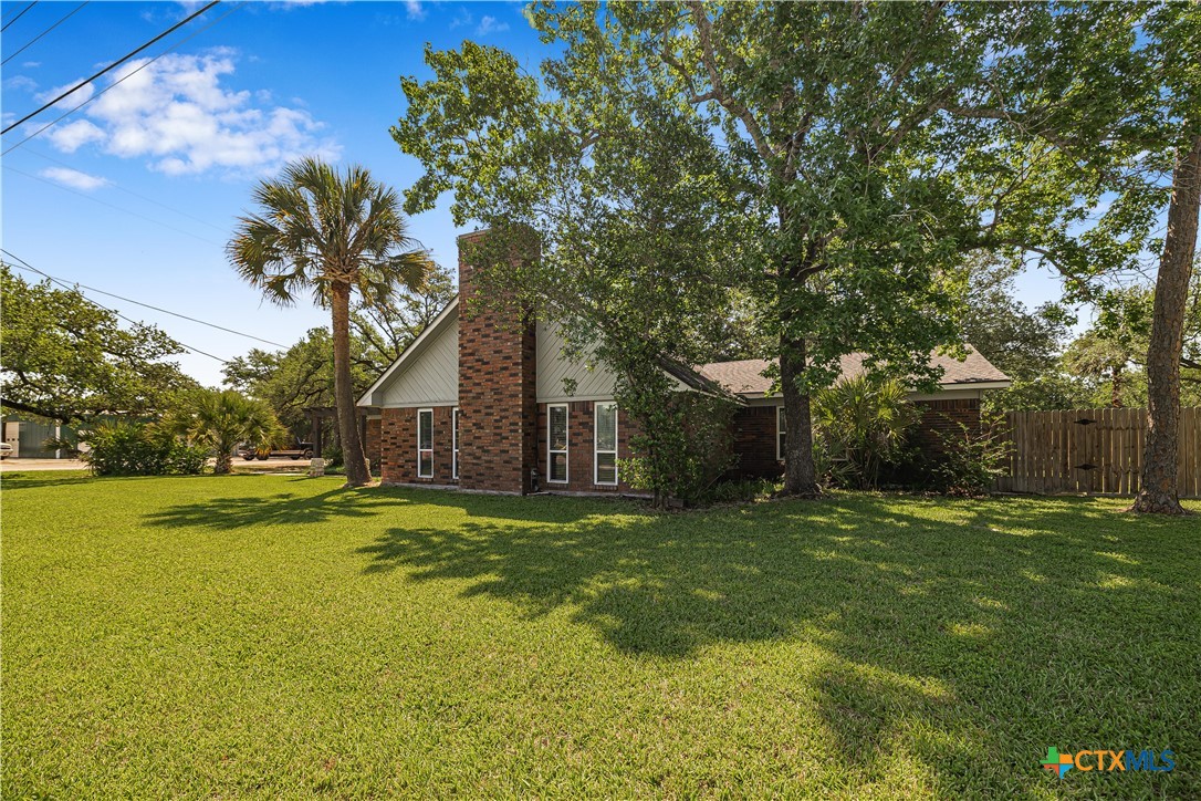 20 Hambleton Road Victoria, TX 77905 - Photo 39 of 48 a big yard with trees in front of it