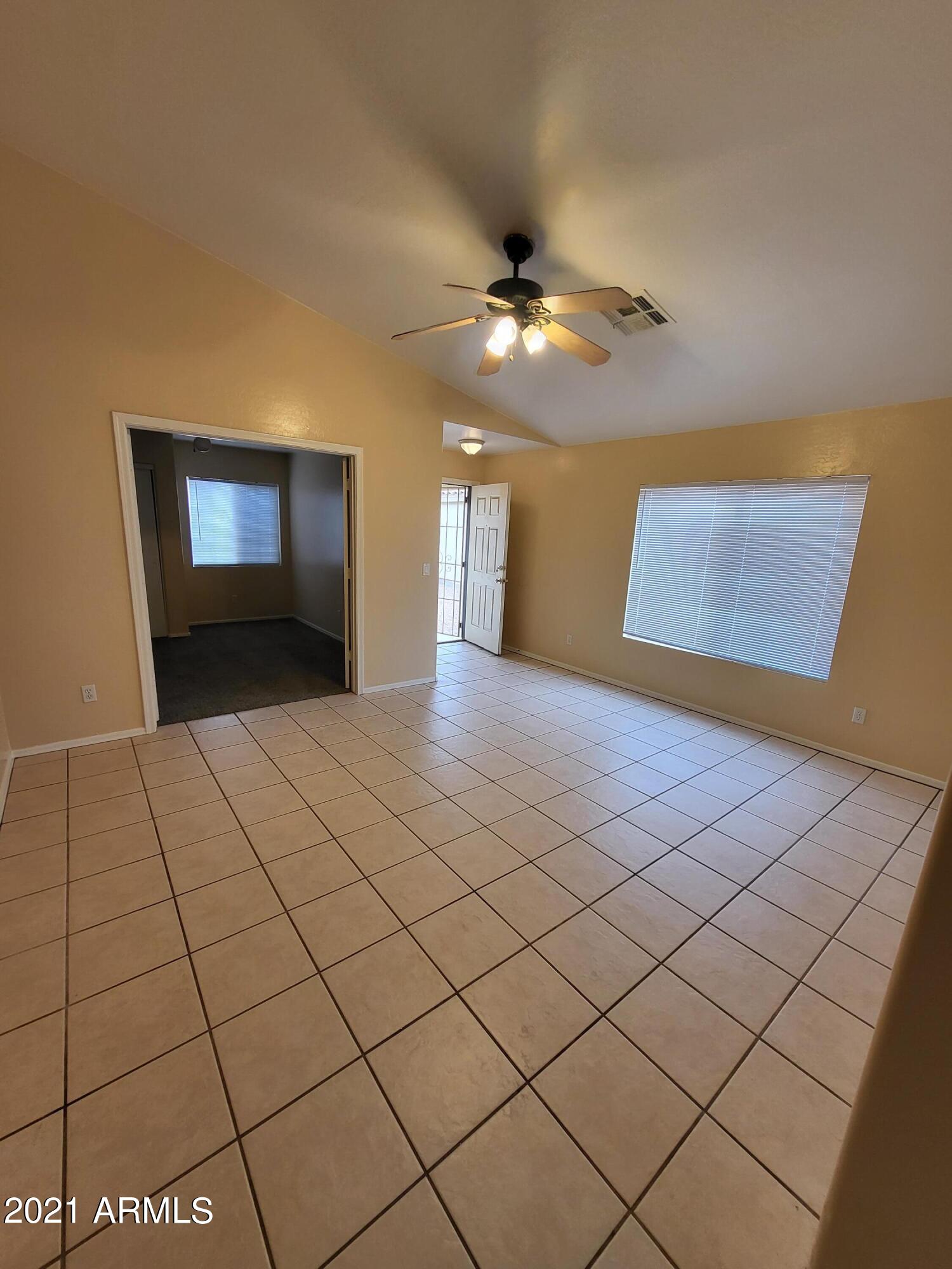 11929 West Larkspur Road El Mirage, AZ 85335 - Photo 2 of 12 a view of an empty room