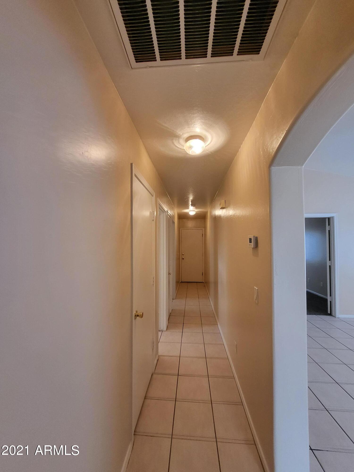 11929 West Larkspur Road El Mirage, AZ 85335 - Photo 7 of 12 a view of a hallway