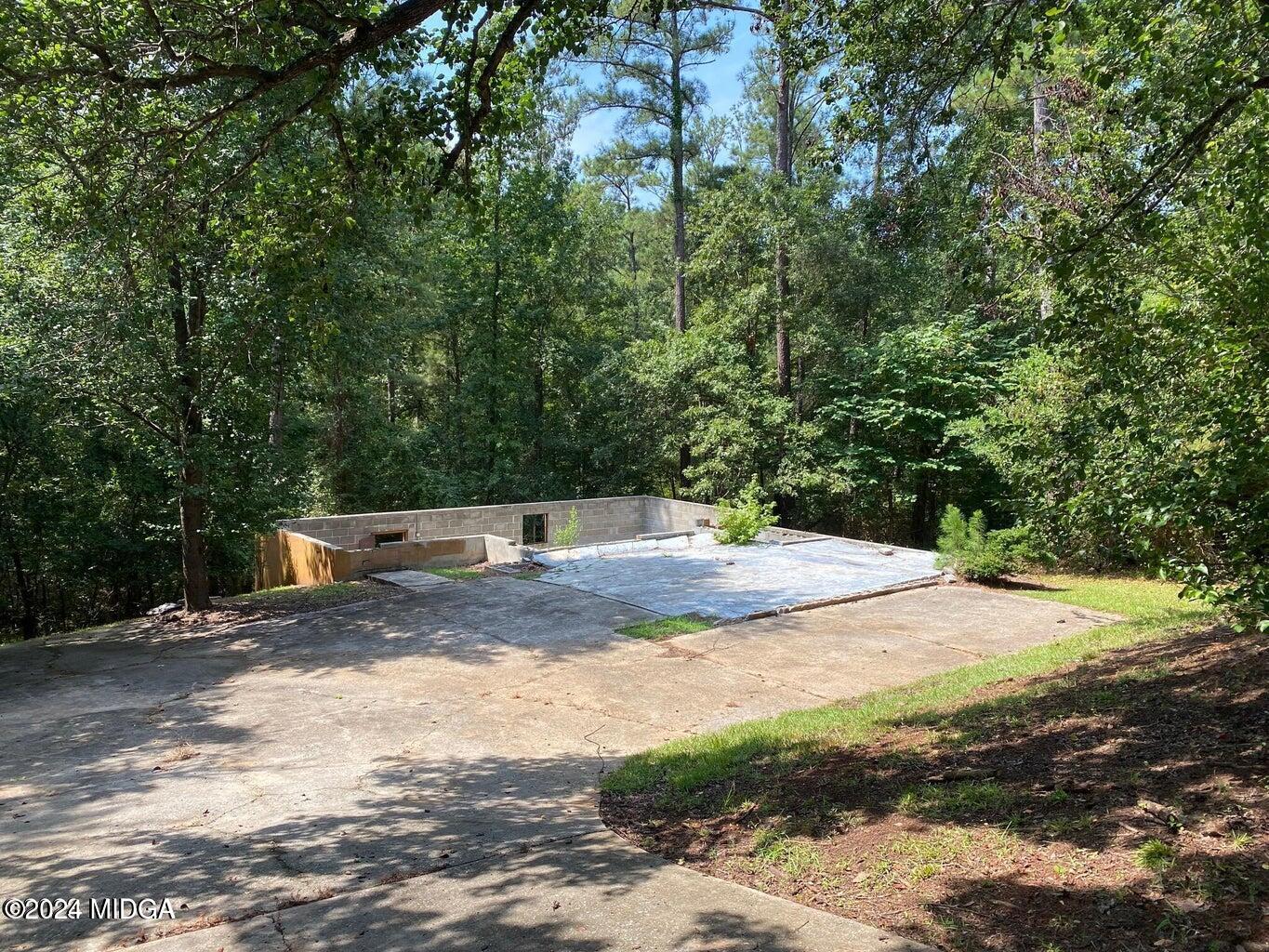 216 River Hills Ridge Road Macon, GA 31211 - Photo 3 of 6 a view of a yard with a tree