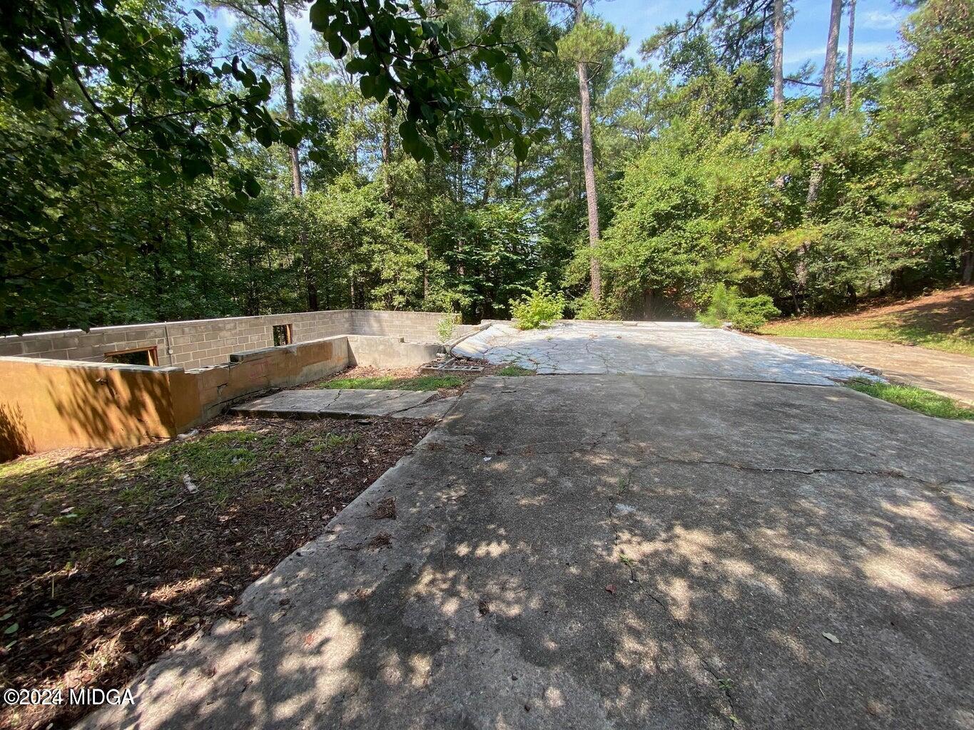 216 River Hills Ridge Road Macon, GA 31211 - Photo 4 of 6 a view of outdoor space with deck and yard