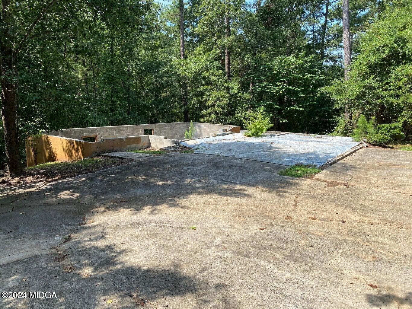 216 River Hills Ridge Road Macon, GA 31211 - Photo 5 of 6 a view of a yard with trees