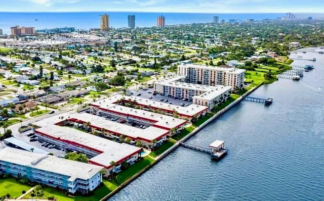 a view of a balcony with city and outdoor seating