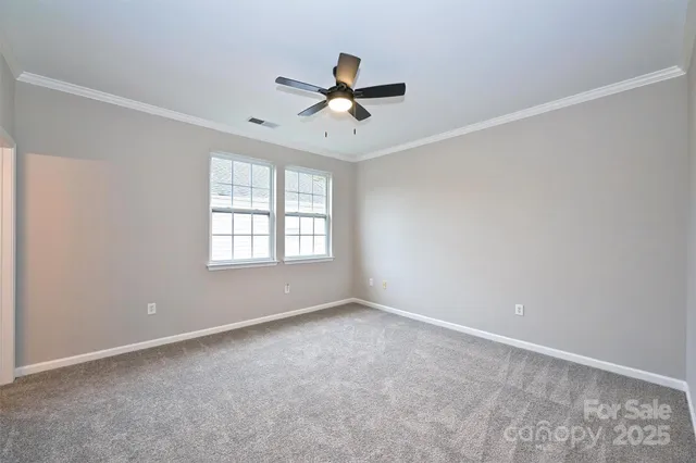 a view of empty room with windows