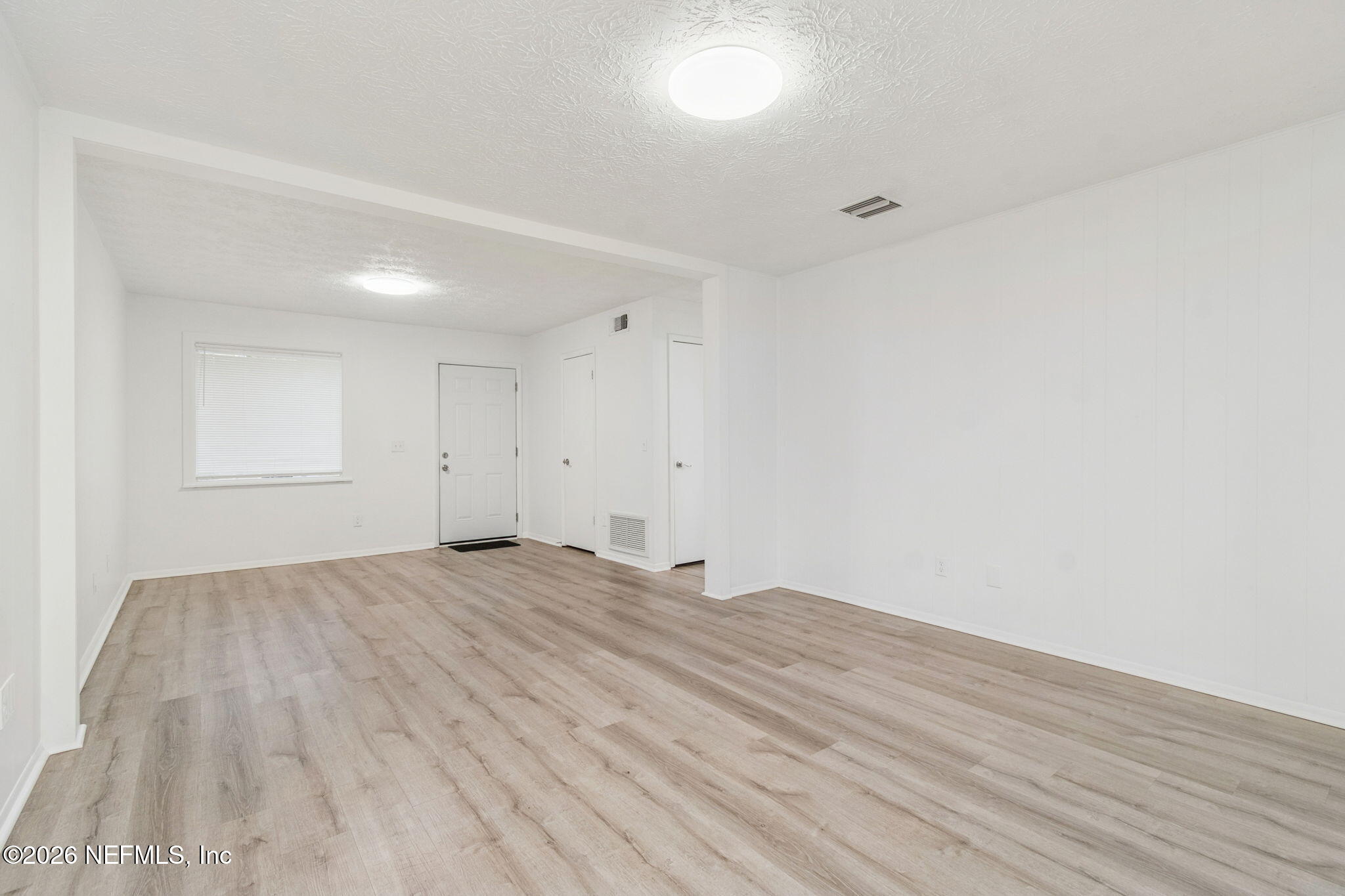 8234 Frost Street South Jacksonville, FL 32221 - Photo 20 of 65 a view of empty room with wooden floor