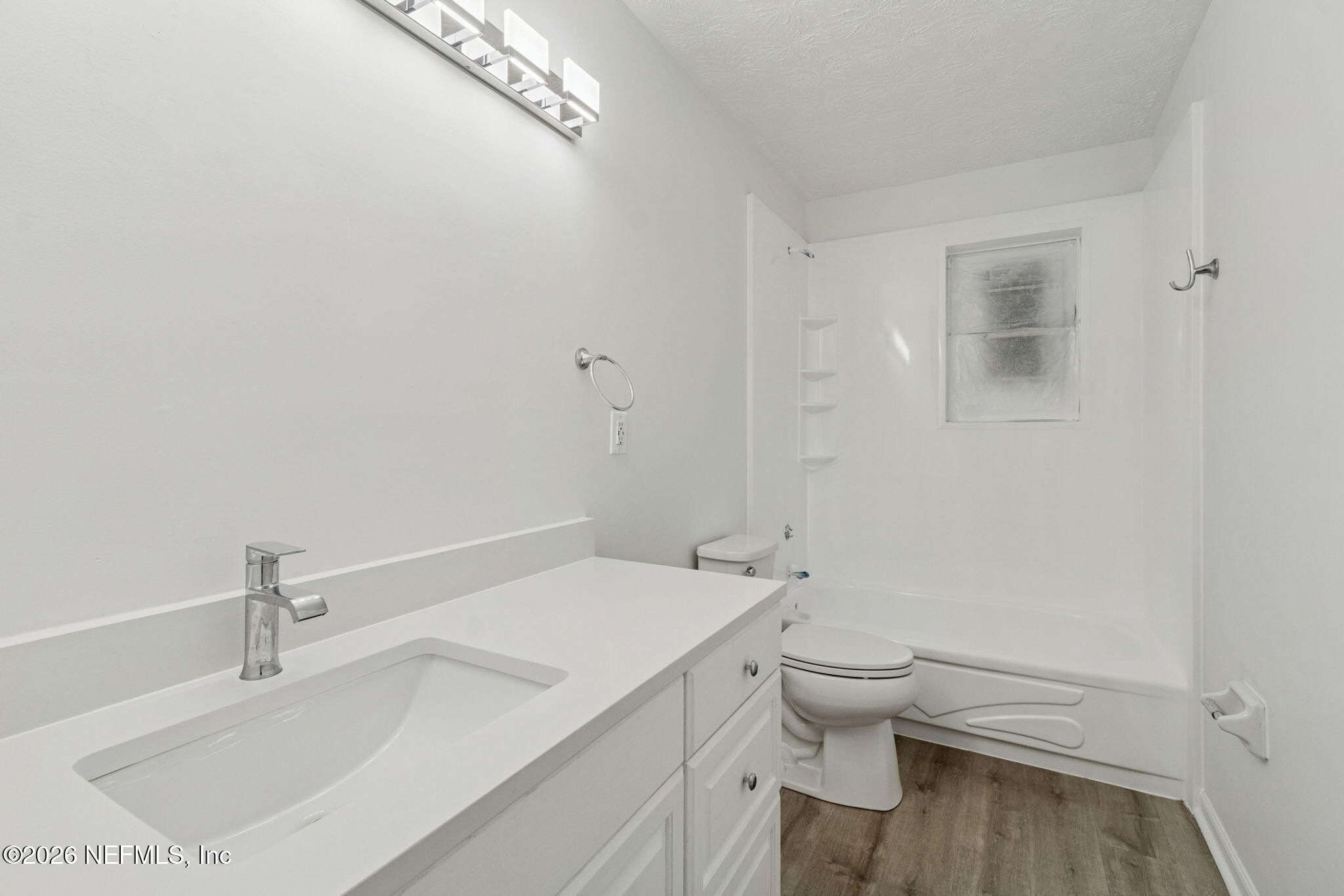 8234 Frost Street South Jacksonville, FL 32221 - Photo 38 of 65 a bathroom with a sink a toilet and a shower