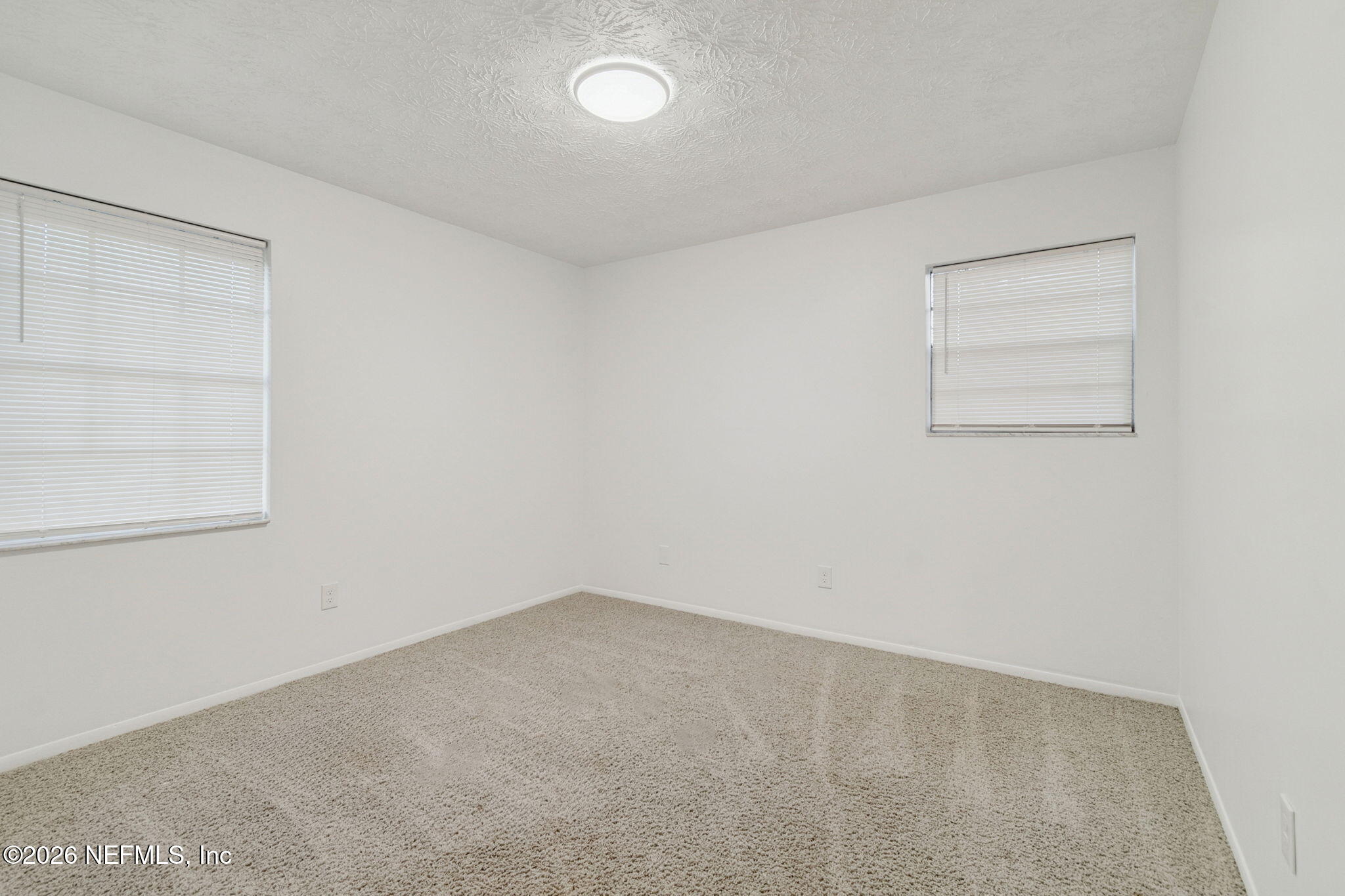 8234 Frost Street South Jacksonville, FL 32221 - Photo 44 of 65 an empty room with a empty space and a window