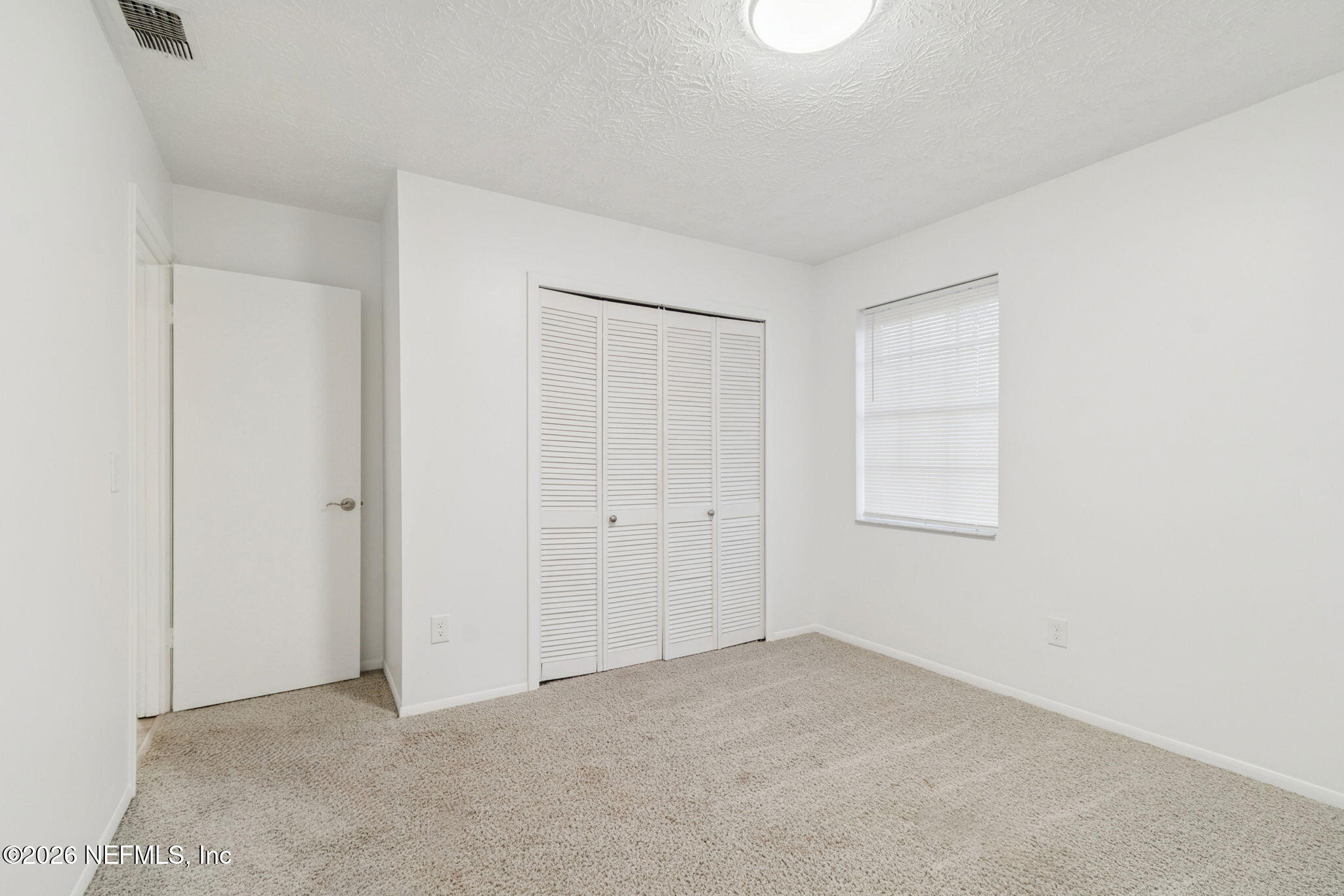 8234 Frost Street South Jacksonville, FL 32221 - Photo 45 of 65 a view of an empty room and window