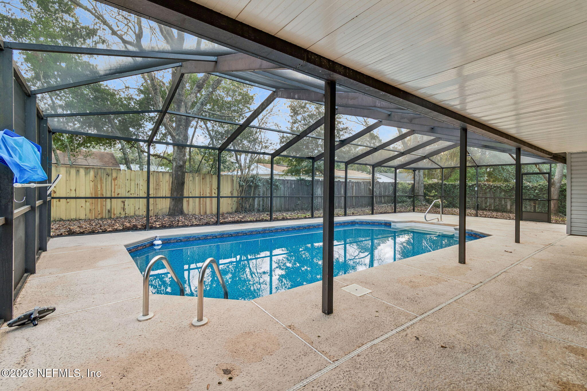 8234 Frost Street South Jacksonville, FL 32221 - Photo 52 of 65 a view of a swimming pool with a porch