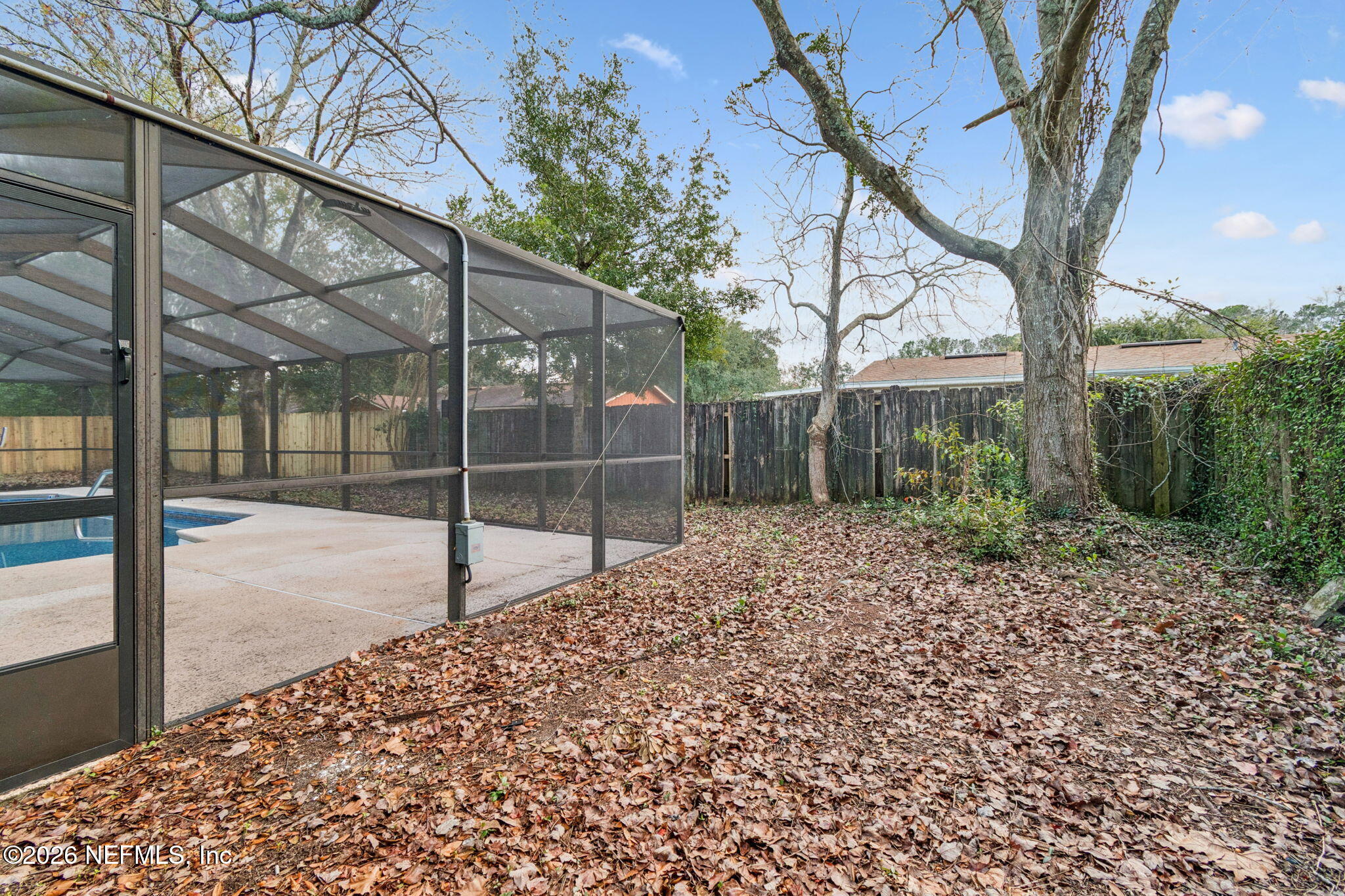 8234 Frost Street South Jacksonville, FL 32221 - Photo 60 of 65 a backyard of a house with lots of green space