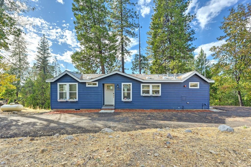 5015 Shooting Star Road Placerville, CA 95667 - Photo 1 of 1 a view of a yard in front of a house with large tree