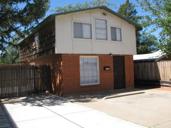 a front view of a house with a garage