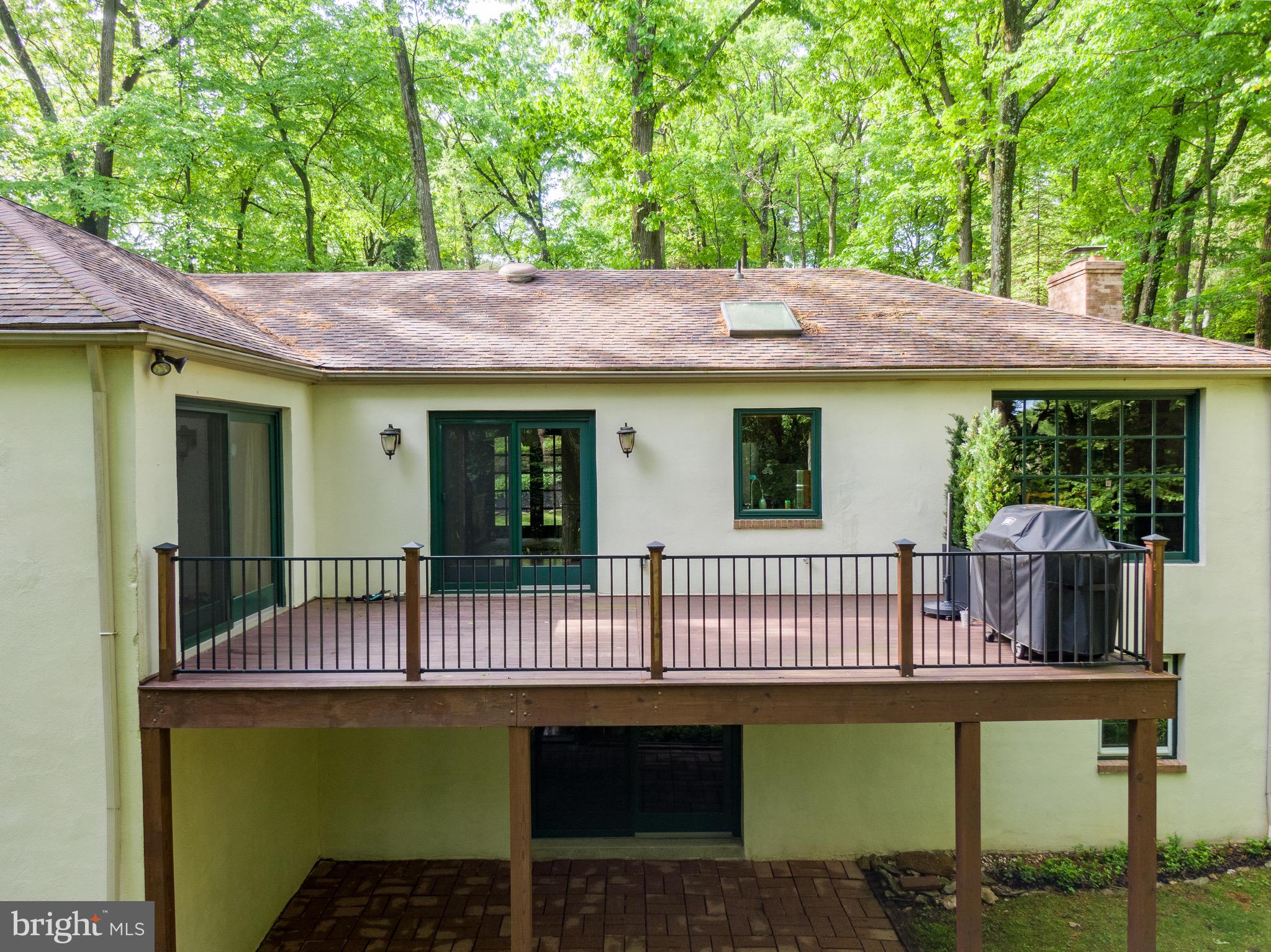 290 Danell Road Wayne, PA 19087 - Photo 15 of 42 deck overlooking lush rear yard