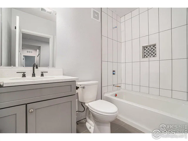 a bathroom with a sink a toilet and bathtub