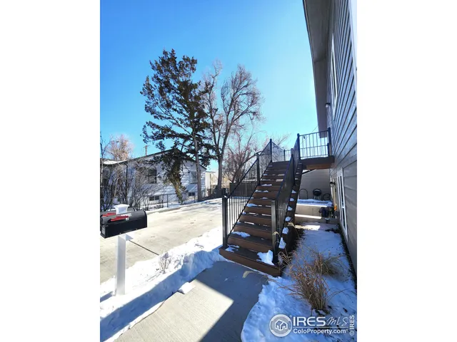 a view of living room with furniture and wooden floor