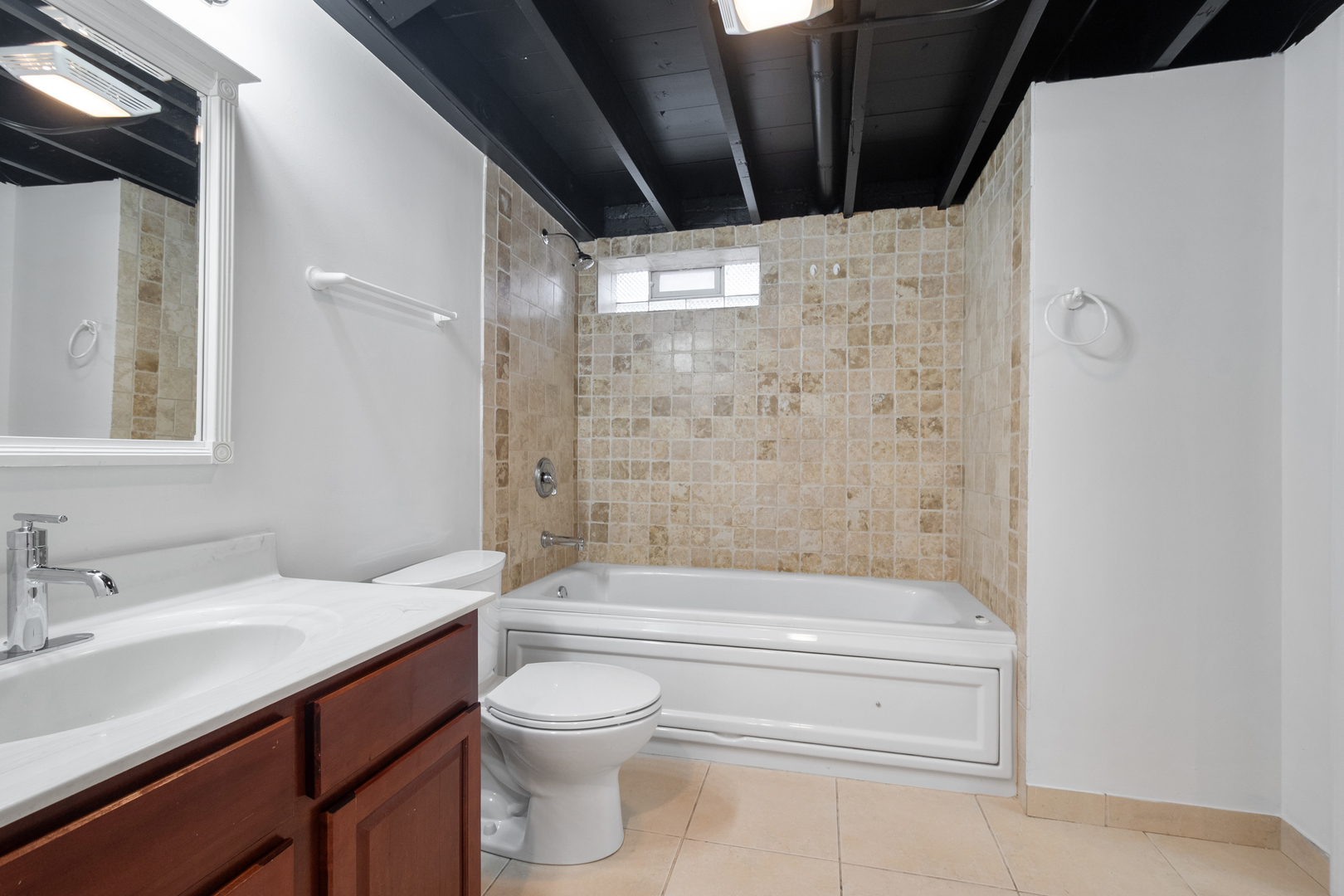 4701 Thatcher Avenue Norridge, IL 60706 - Photo 15 of 23 a bathroom with a bathtub shower sink vanity and toilet