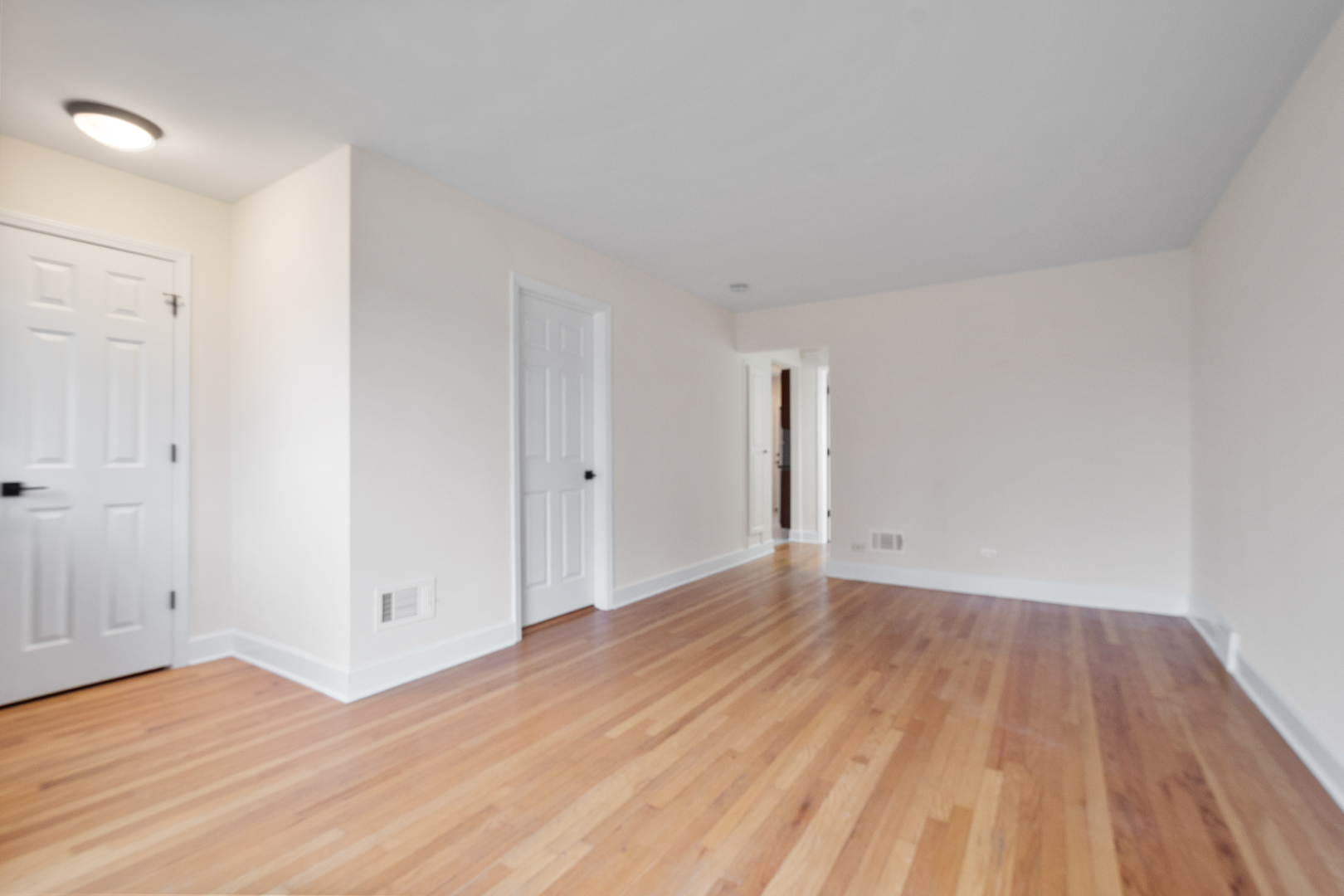 4701 Thatcher Avenue Norridge, IL 60706 - Photo 5 of 23 a view of an empty room and wooden floor