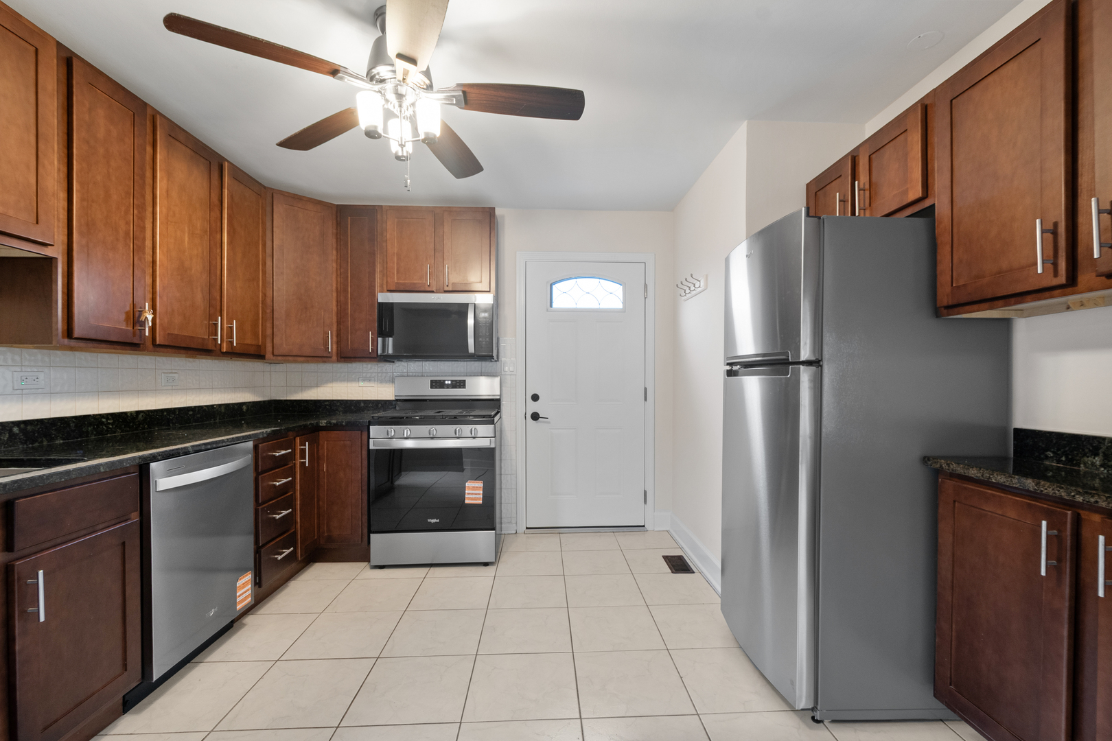 4701 Thatcher Avenue Norridge, IL 60706 - Photo 6 of 23 a kitchen with stainless steel appliances granite countertop a refrigerator oven a washer and dryer