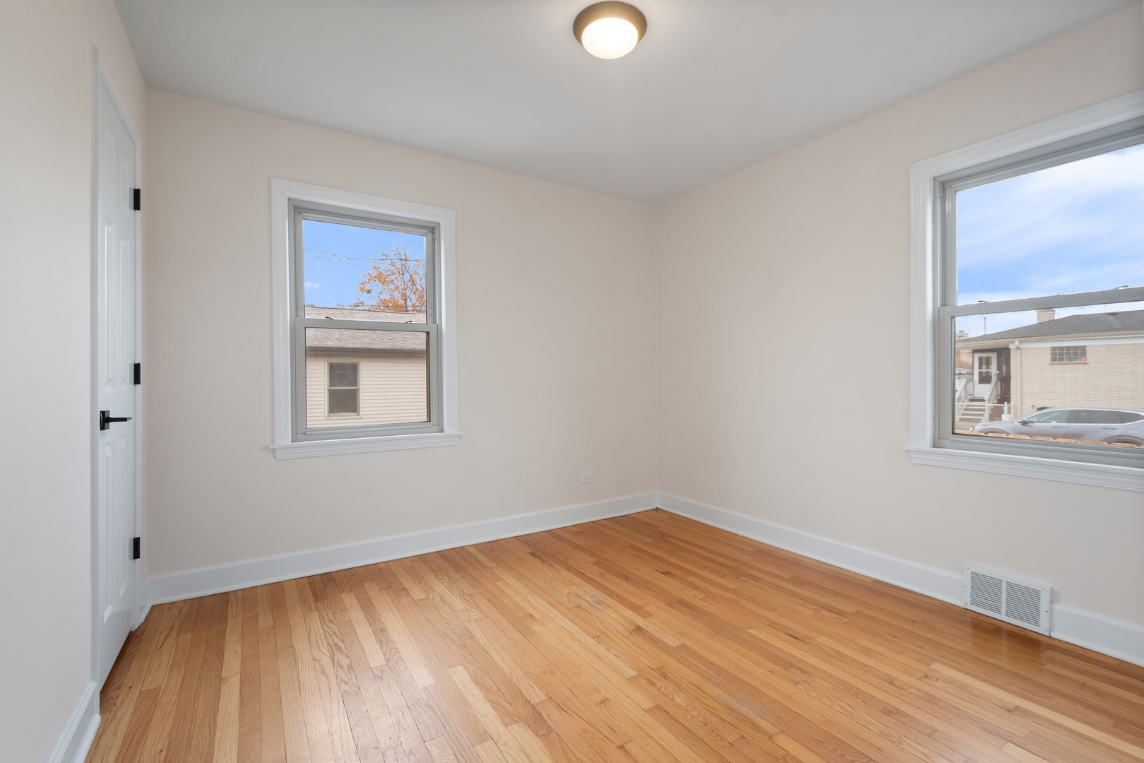 4701 Thatcher Avenue Norridge, IL 60706 - Photo 9 of 23 a view of a room with wooden floor and window