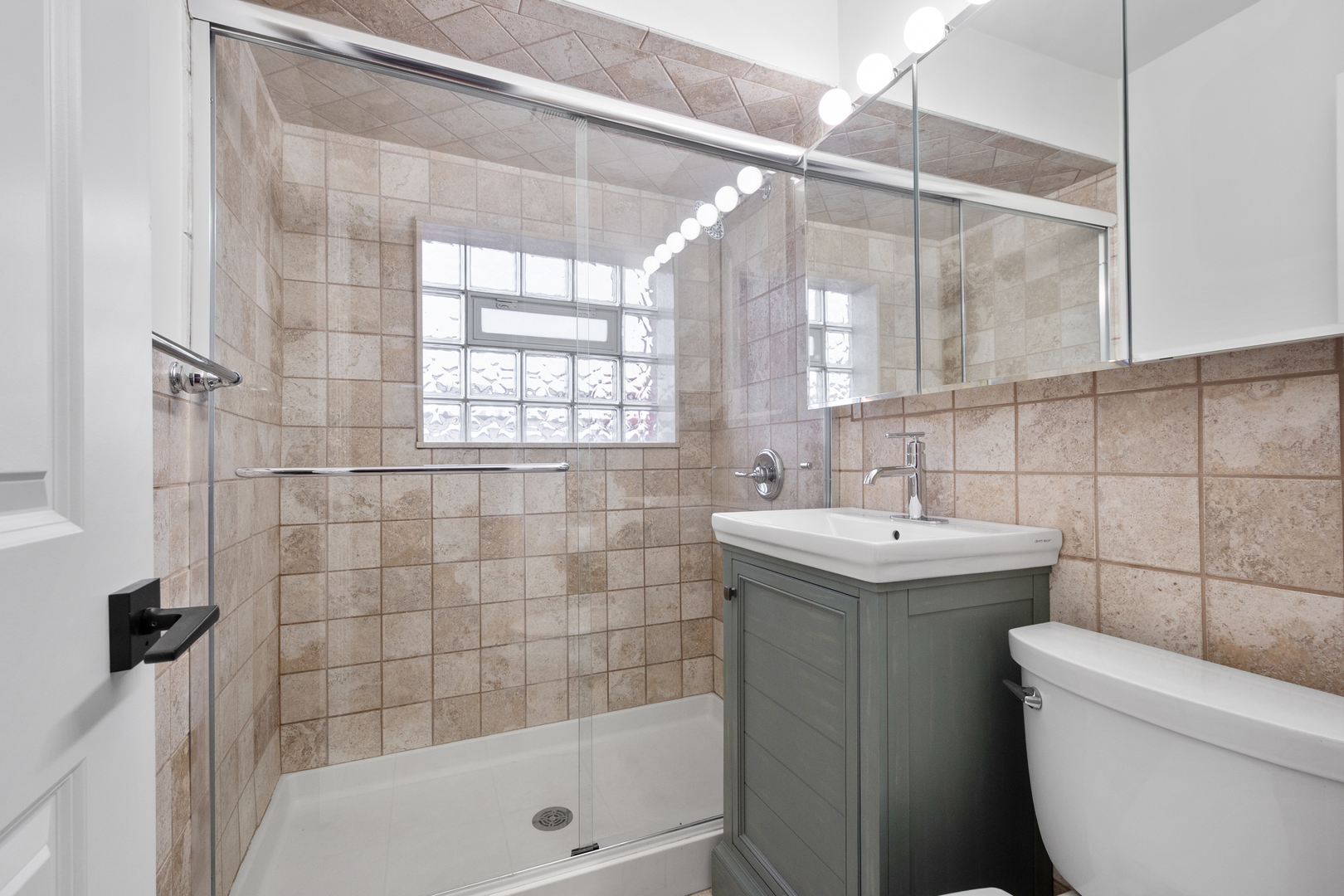 4701 Thatcher Avenue Norridge, IL 60706 - Photo 10 of 23 a bathroom with a sink toilet and shower