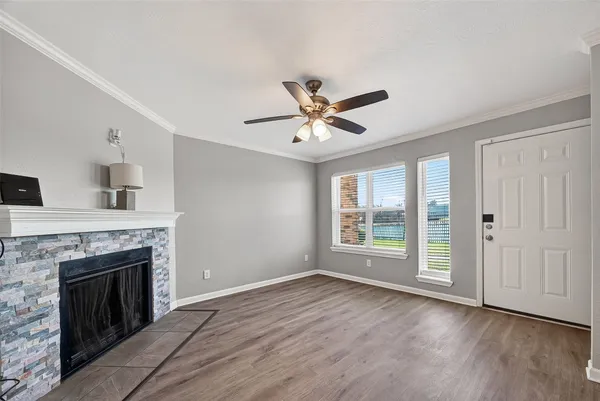 a view of livingroom with hardwood floor and a fireplace
