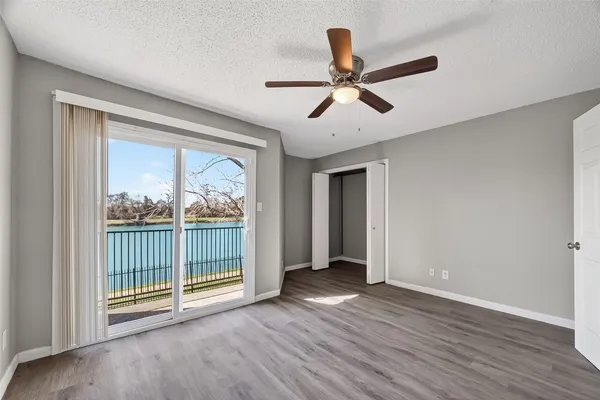 a view of a livingroom with a ceiling fan and window