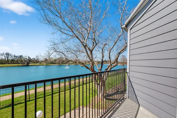 a side view of a house with a balcony