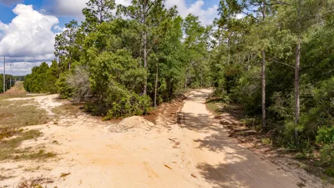 a view of a backyard of the house